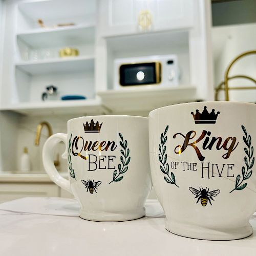 Two mugs with text 